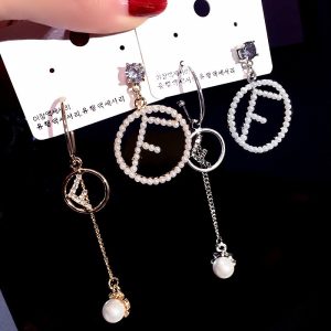 Replica Designer FENDI Women Pearl Micro-Set Letter Asymmetric Individual Stud Earrings